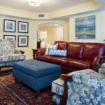 A vintage, coastal design incorporated my client's love of heirloom area rugs and leather furniture with the condos location on the shore of the Atlantic ocean in Cape Canaveral, FL. New tapestry side chairs, coffee table, lamps and artwork complete the comfortable look.