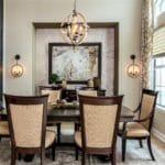 Formal dining room is both casual and elegant, rustic and modern. Custom drapes are a linen fabric with a metallic floral design. Silver metallic wall covering provides an elegant backdrop.