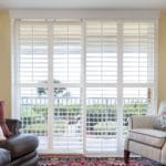 Plantation shutters were the prefect solution for these sliding doors adding to the decor instead of using vertical blinds.
