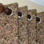 Curtains in menswear inspired paisley fabric with modern grommet heading.
