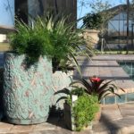 Outdoor design includes rustic stone planters