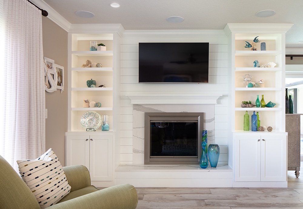 Fireplace remodel includes shiplap fireplace wall with Cambria Britanica