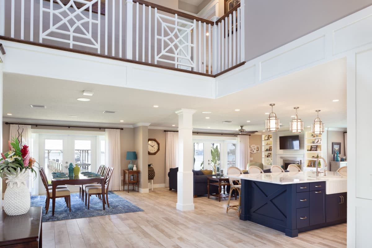 Whole house redesign begins with a two story entry welcoming you with a custom stair case and railing. Wood beams accent the expansive ceiling.